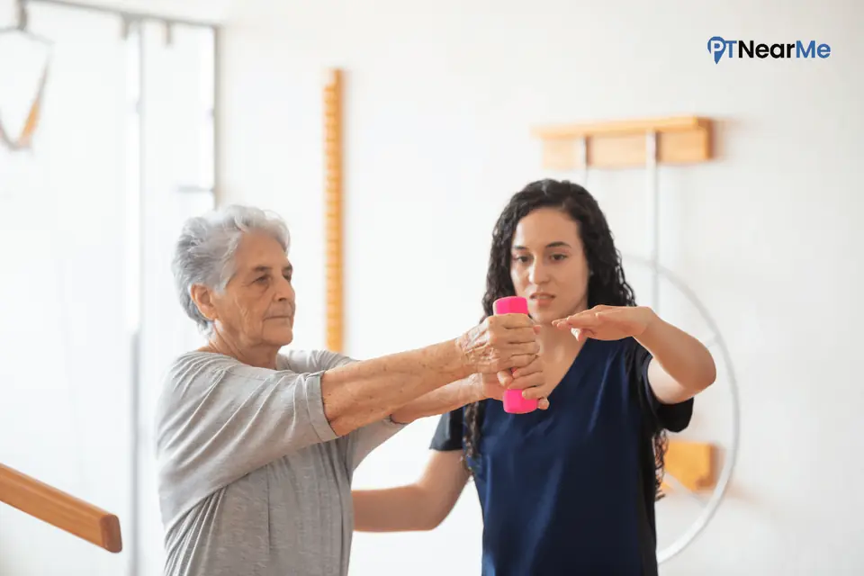 In-home physical therapist working on upper-extremity strength with an older adult in Florida.